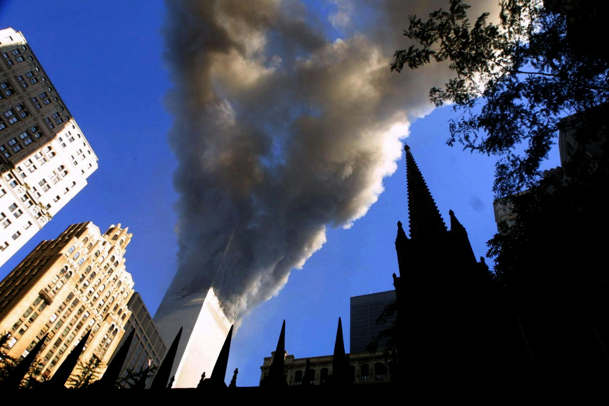 Smoke spews from a tower of the World Trade Center on Sept. 11, 2001, after two hijacked airplanes hit the twin towers in a terrorist attack on New York City. Jelani Eddington said he didn’t realize both towers had been hit until someone pointed it out to him. Mario Tama/Getty Images/TNS, Photo Courtesy 