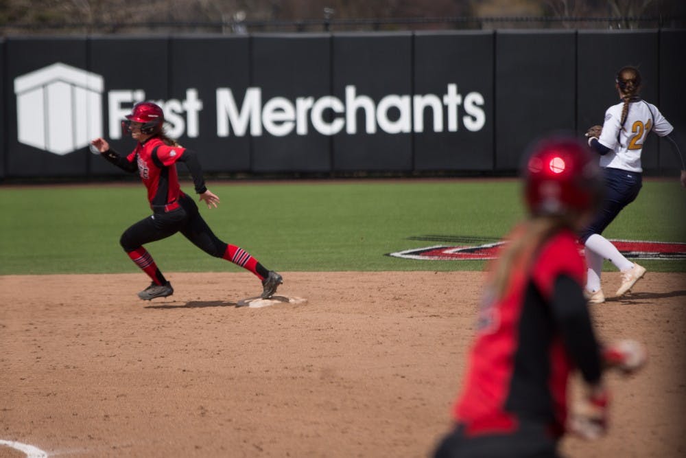 Taylor Castleberry rounds second after Stacy Payton hits a ball to the outfield in the fifth inning during the Cardinals' game against Kent State April 7 at the Softball Field at First Merchants Ballpark Complex. Eric Pritchett, DN