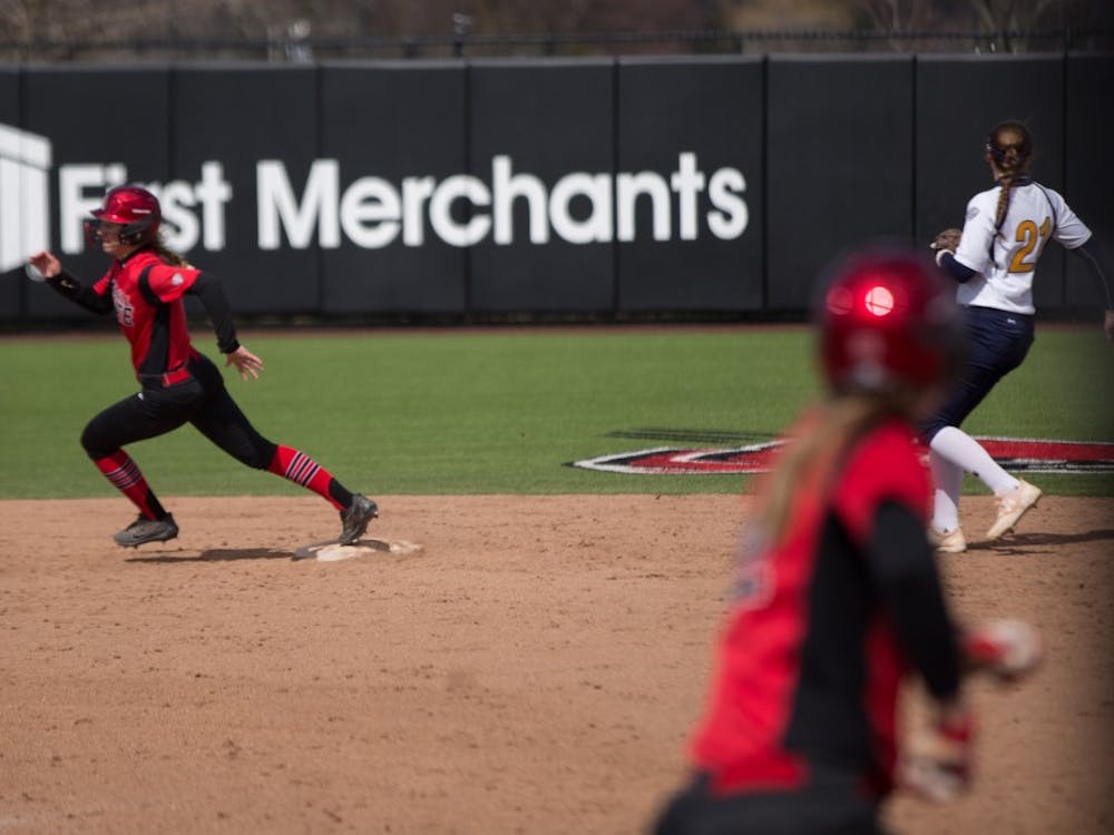 Taylor Castleberry rounds second after Stacy Payton hits a ball to the outfield in the fifth inning during the Cardinals' game against Kent State April 7 at the Softball Field at First Merchants Ballpark Complex. Eric Pritchett, DN