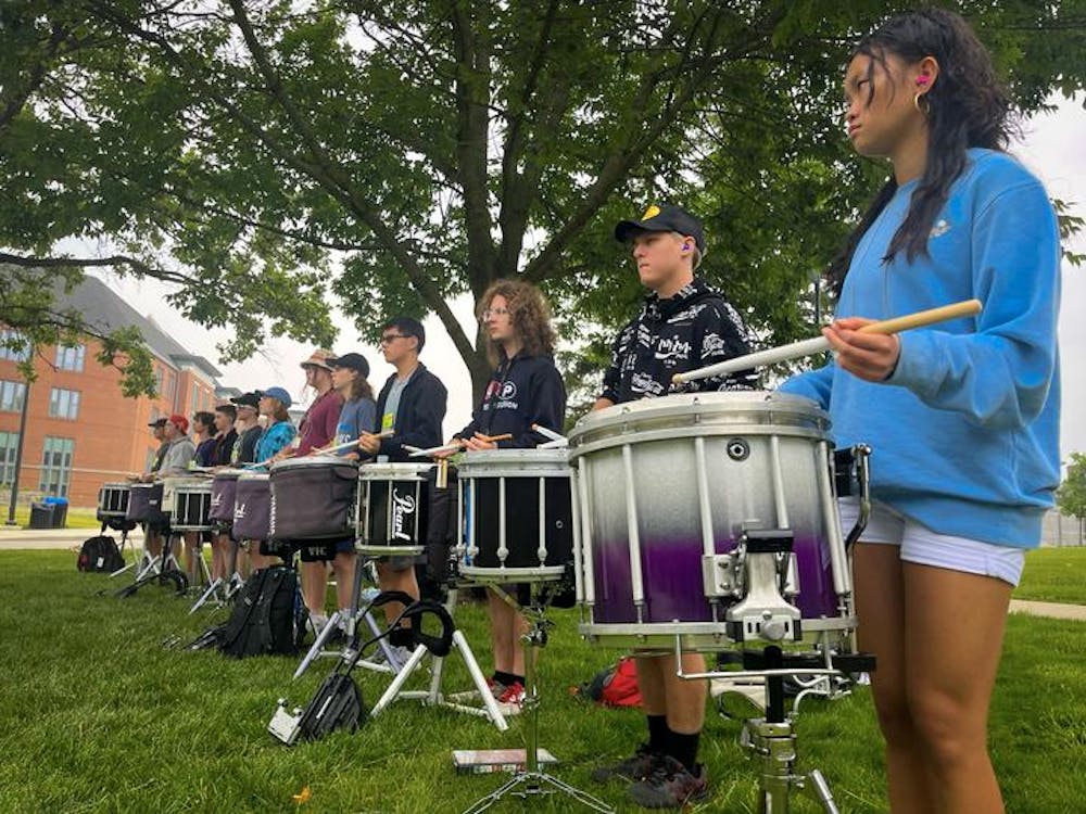 Drummers take their cues for rehearsal from team leaders at Music For All Summer Symposium, June 27, 2023. Several hundred students from across the country converged on Ball State's campus for the weeklong event that included not just musical instruction, but games and other team-building events. Madelyn Moore, DN