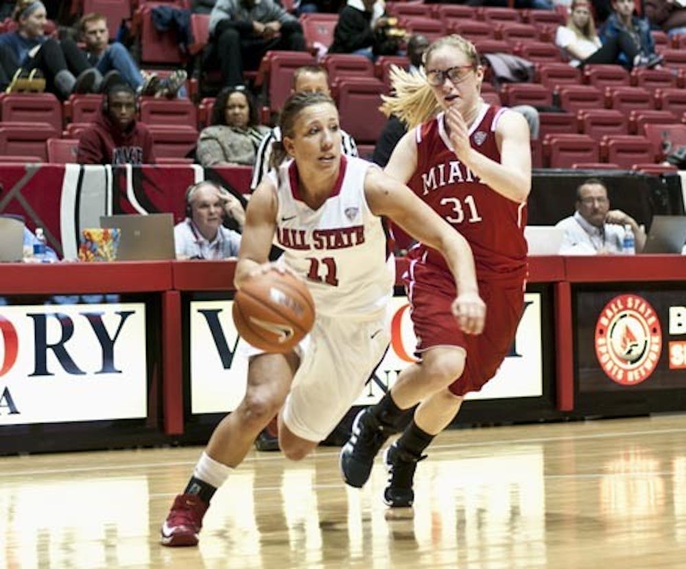 Junior guard Brandy Woody drives towards the basket during the Ball State victory over Miami on Jan. 16, 2012. The Cardinals fell to Bowling Green 73-42 on Wednesday. DN FILE JONATHAN MIKSANEK