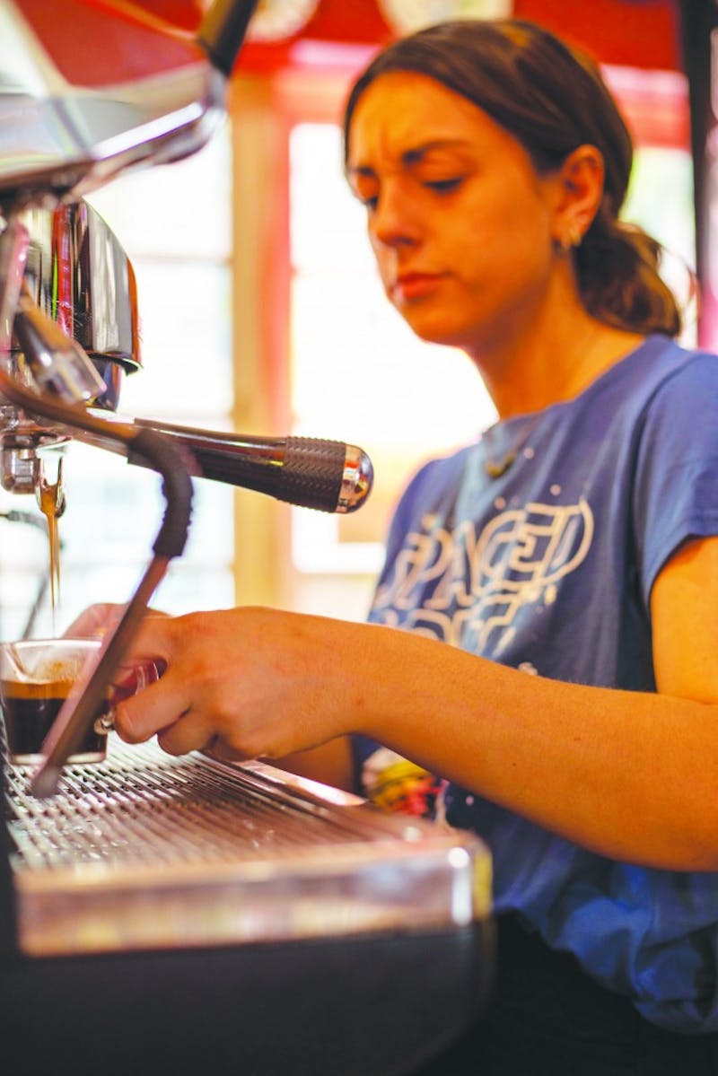 A worker at The Cup makes shots of espresso for a customer’s drink Sept. 8, 2019. The Cup has offered drinks such as smoothies, teas, coffees and more since 2012. Jacob Musselman, DN. 