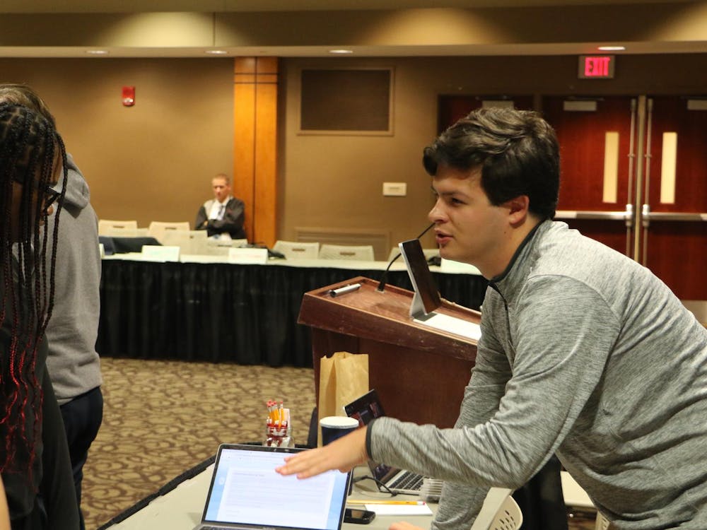 Pro Tempore Hunter Case assigning new senate members their caucuses and committees, during Student Government Association weekly meeting in L.A. Pittenger Student Center. Landon Jones, DN