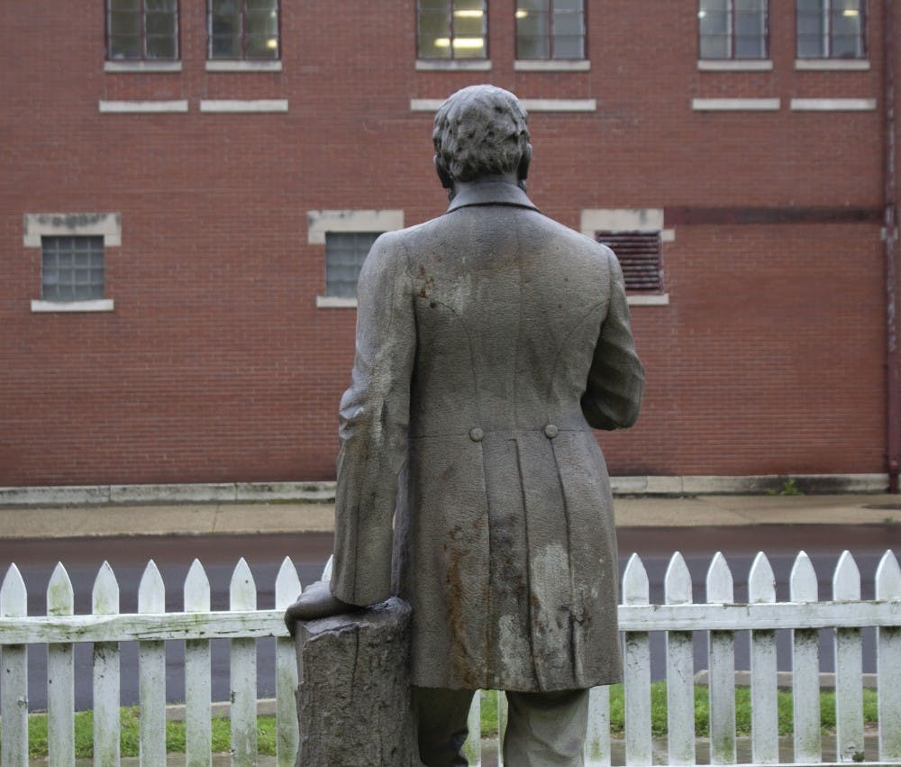 The statue of Charles Willard looks out at the East Washington Street outside Delaware County Historical Society. The statue was returned home to Muncie, after being gone in Tennesse for 50 years. Patrick Murphy,DN