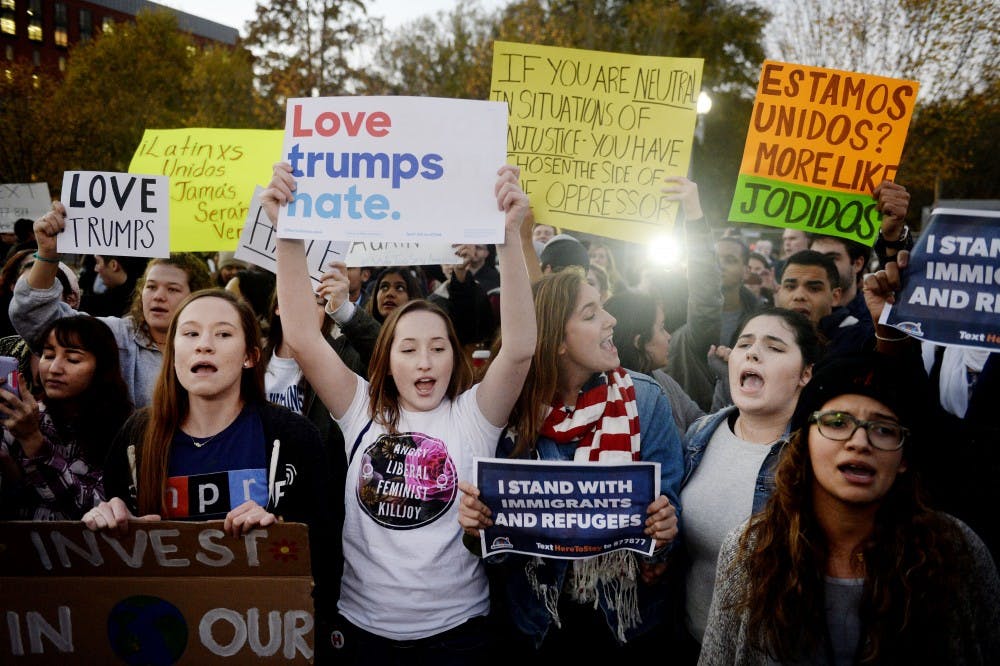 Protesters gather outside the White House after Donald Trump's first visit as president-elect on Thursday, Nov. 10, 2016, in Washington, D.C. (Olivier Douliery/Abaca Press/TNS)