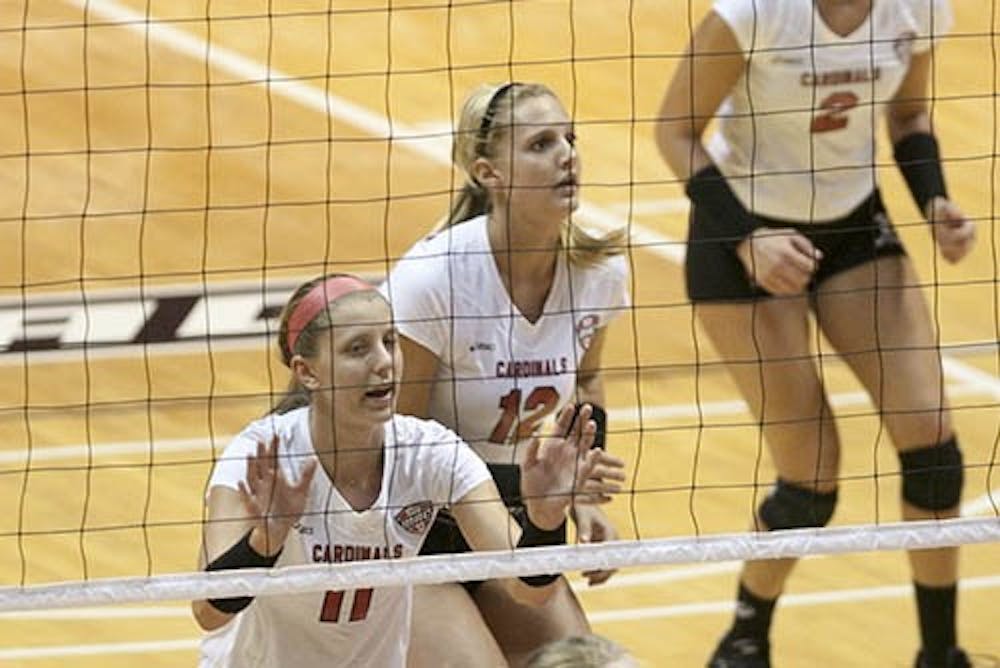 Senior Jacqui Seidel and sophomore Jenna Spadafora play during the game against Indiana University-Purdue University Indianapolis. Seidel and Spadafora share time as starting setters. DN FILE PHOTO JORDAN HUFFER