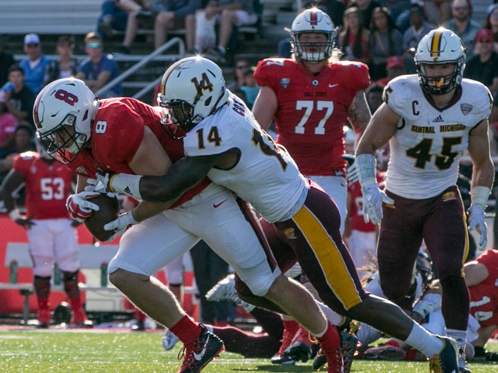 Redshirt junior fullback Cody Rudy attempts to run the ball during the homecoming game against Central Michigan Oct. 21, 2017, in Scheumann Stadium. The Cardinals fell, 56-9. Kaiti Sullivan, DN File