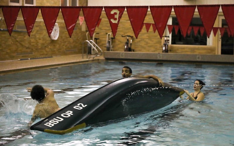 Team Woody tips over after taking too much water from Team Exes and Flexes in the Championship Round Feb. 6, 2020, at Ball Gymnasium pool. Team Woody, was made up of freshmen Ronnie Coleman and Jordan Woods their team finished second overall. Hannah Gunnell, DN