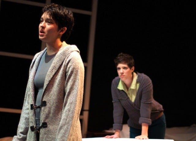 DN PHOTO RJ RICKER

Sarah Paradise’s character, left, says she’s lost herself while searching among boxes packed up during spring cleaning while her spouse, played by Kara Schoenhofer, tries to figure out what’s wrong. Paradise’s and Schoenhofer are both actresses in Ball State’s production of “Love/Sick.” 