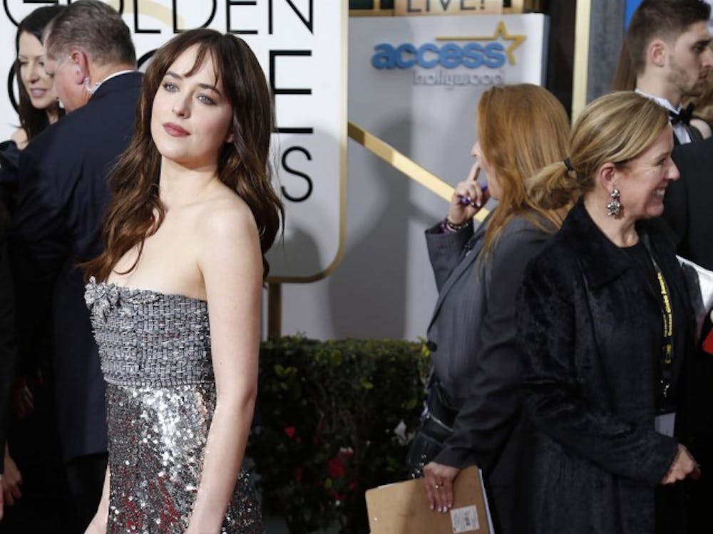 Dakota Johnson arrives at the 72nd Annual Golden Globe Awards show at the Beverly Hilton Hotel in Beverly Hills, Calif., on Sunday, Jan. 11, 2015. (Wally Skalij/Los Angeles Times/TNS)