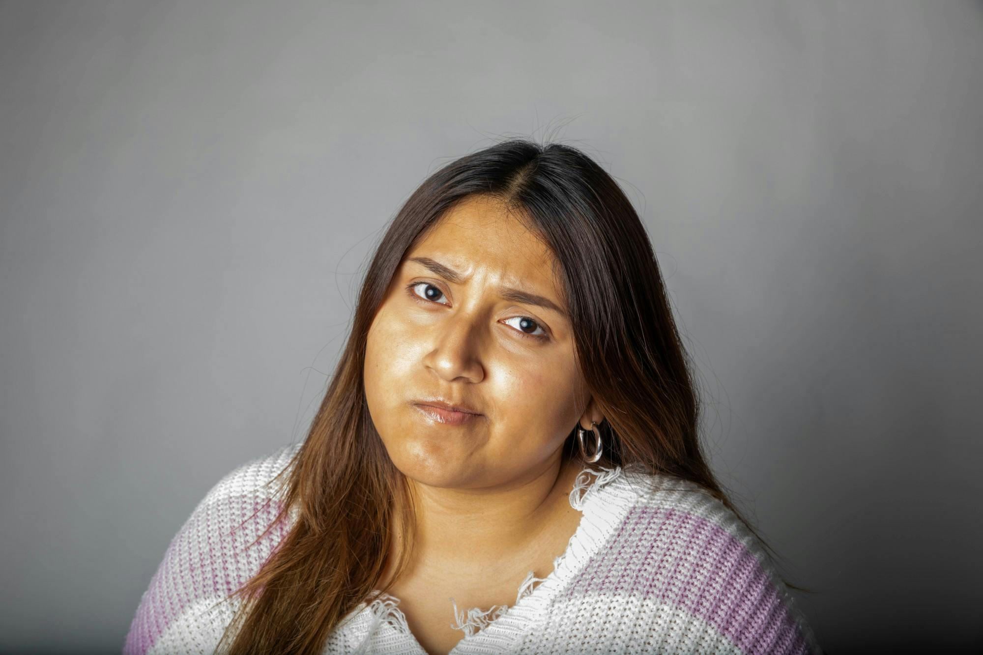 Senior journalism and telecommunications major Delmy Hernandez poses for a photo March 30, 2021, in the photojournalism studio. Jaden Whiteman, DN