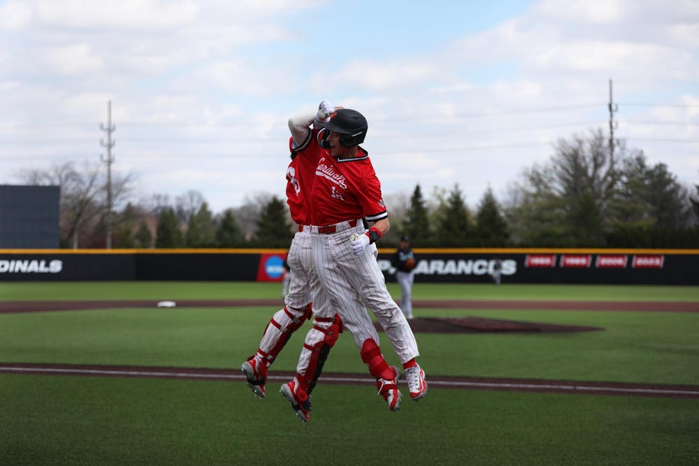 <p>Senior outfielder Nick Gregory (right) celebrates his home run with freshman catcher Max Kalk (left) March 30 at First Merchants Ballpark Complex. Gregory had three runs in the game. Mya Cataline, DN</p>