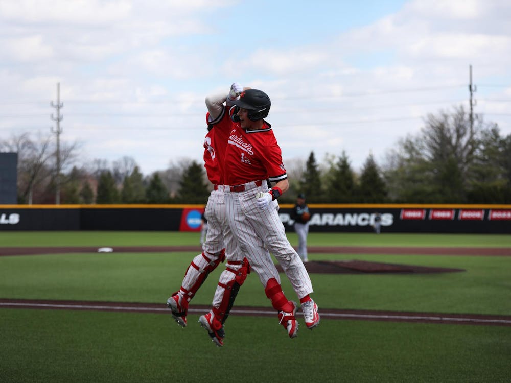 Senior outfielder Nick Gregory (right) celebrates his home run with freshman catcher Max Kalk (left) March 30 at First Merchants Ballpark Complex. Gregory had three runs in the game. Mya Cataline, DN