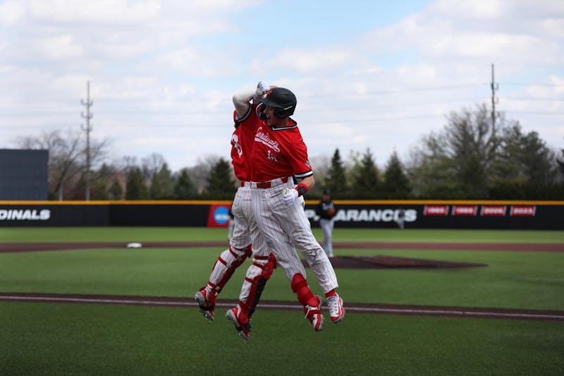 Senior outfielder Nick Gregory (right) celebrates his home run with freshman catcher Max Kalk (left) March 30 at First Merchants Ballpark Complex. Gregory had three runs in the game. Mya Cataline, DN