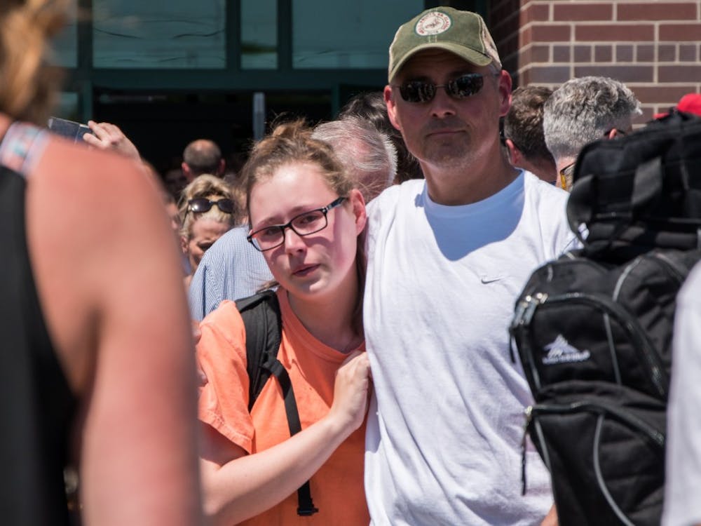 Noblesville High School students waited to be picked up after being put on lockdown due to a communicative threat and a school shooting at Noblesville West Middle School Friday, May 25. Parents waited in line more than 90 minutes to pick up their kids, though superintendent Beth Niedermeyer said there would be a regular release for those students who wouldn't be able to be picked up. Stephanie Amador, DN Photo