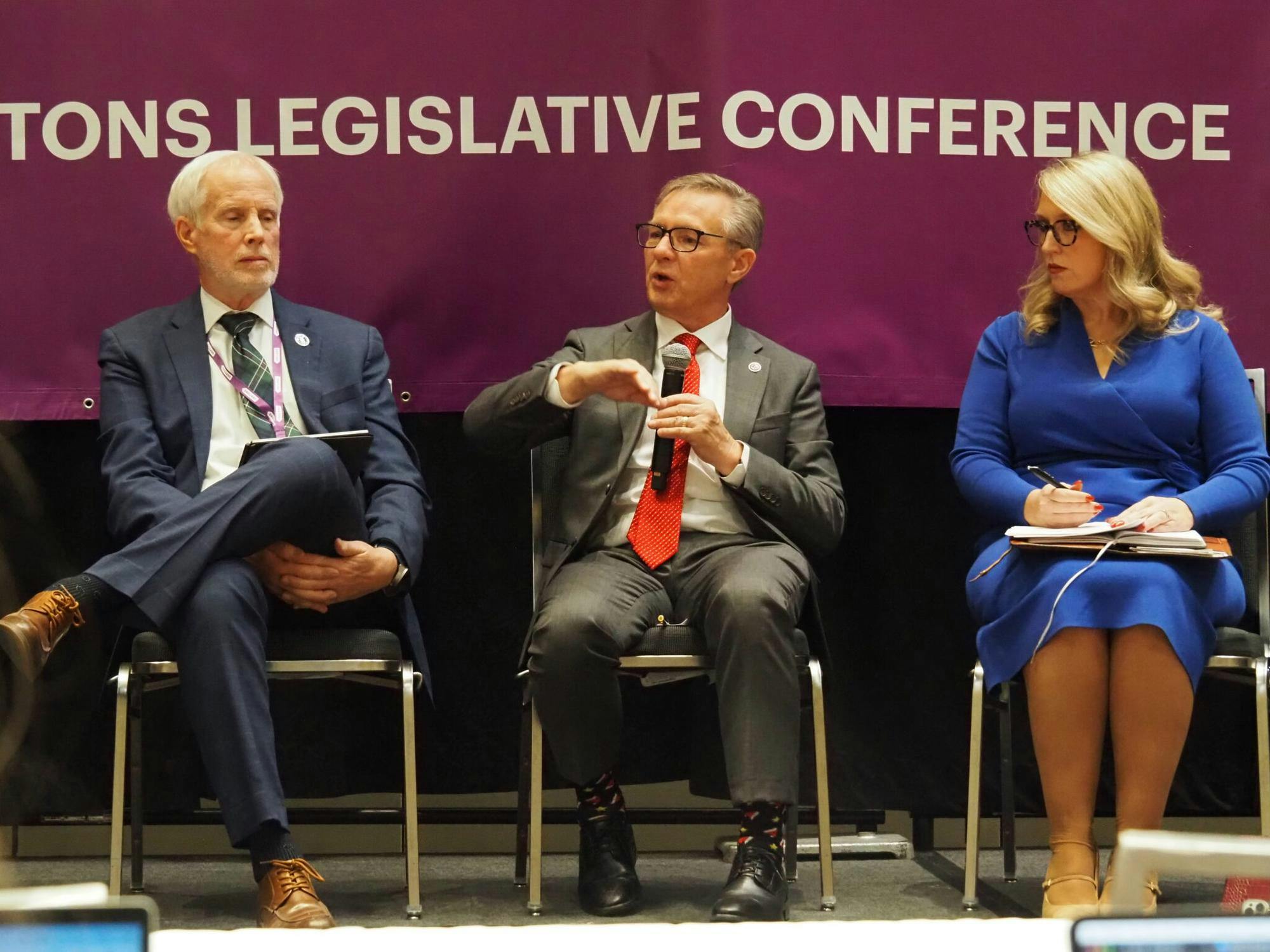 Rep. Bob Behning, R-Indianapolis (left), Sen. Jeff Raatz, R-Richmond (center) and Indiana Secretary of Education Katie Jenner (right) at the annual Dentons Legislative Conference on Thursday, Dec. 18, 2025, held at the Indiana Convention Center in downtown Indianapolis. (Photo by Leslie Bonilla Muñiz/Indiana Capital Chronicle)