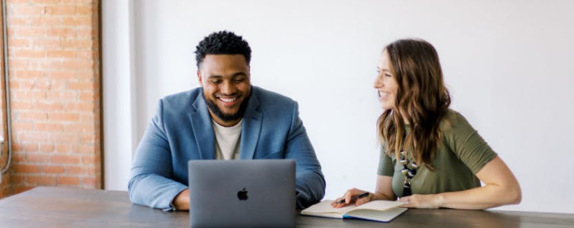 Harold Hogue, CoSpero Consulting managing partner, talks with his business partner Lauren Coppedge. CoSpero Consulting, Photo Courtesy