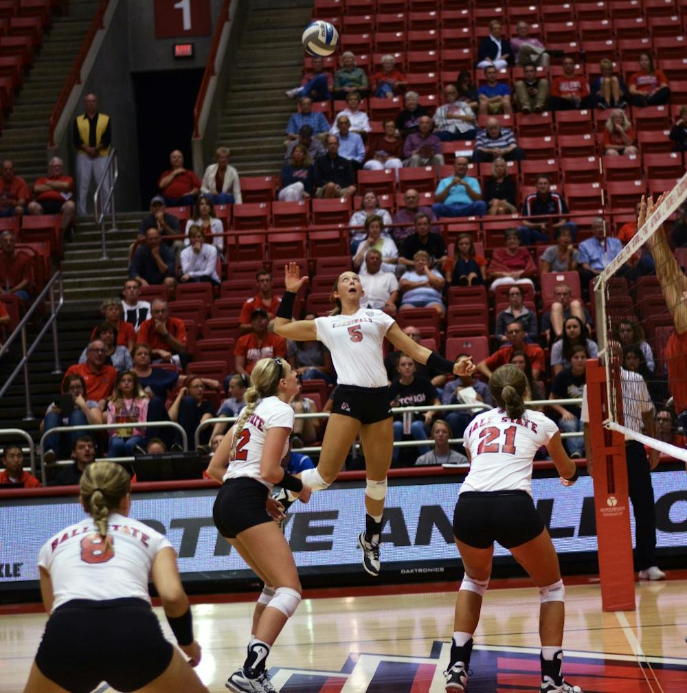 Sophomore outside hitter Bailey Baumer attempts to hit the ball over the net in the second game of the Active Ankle Tournament against Belmont on Aug. 28 at Worthen Arena. DN PHOTO BROOK HAYNES
