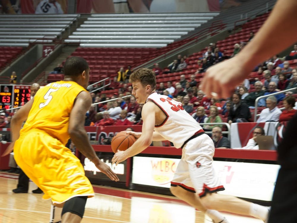 Ball State junior Ryan Weber attempts to get pass Valparaiso's defense during the game on Nov. 28 at Worthen Arena. DN PHOTO AMER KHUBRANI