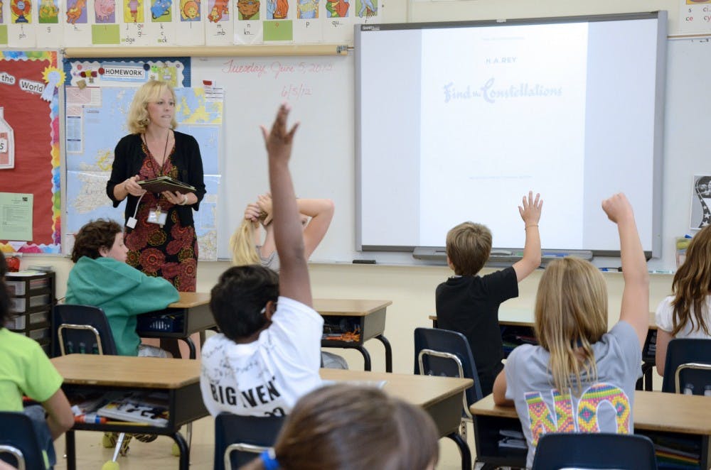 Third-grade teacher Patti Weber projects images of constellations and planets from her iPad on a SMART Board during class at Providence Spring Elementary School in Charlotte, N.C., on June 5, 2012. In the coming year, almost 4,000 students in the Charlotte school system will get classroom iPads, while about 20 schools will invite students and teachers to use their own tablets, phones and e-readers. The third graders at Providence Spring Elementary will be getting 70 iPads for classroom use. (Diedra Laird/The Charlotte Observer/MCT)
