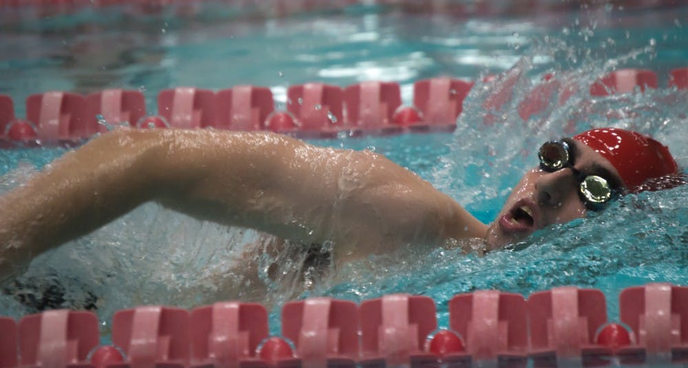 <p>Senior Issac Walling swims the 1000 yard freestyle during the meet against Tiffin on Nov. 11 in the Lewellen Aquatic Center. Teri Lightning Jr., DN</p>