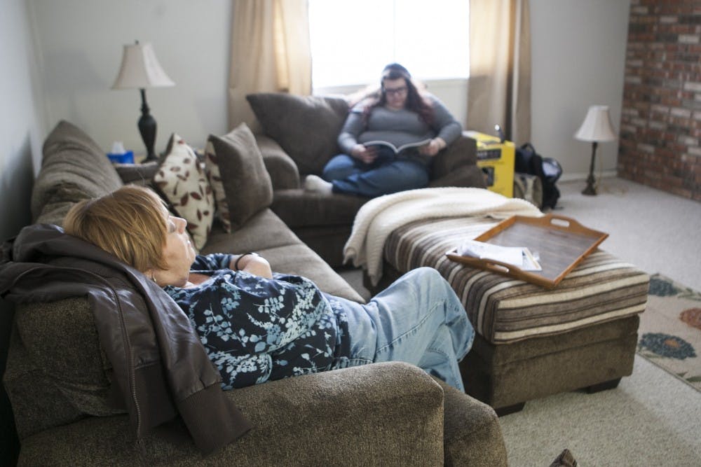 Pam Huffer takes a rest after spending the morning moving into her new home in Muncie in January 2014 after her husband died in September 2013. Huffer passed away Oct. 9, leaving her two daughters Emily and Jordan. DN FILE PHOTO JORDAN HUFFER