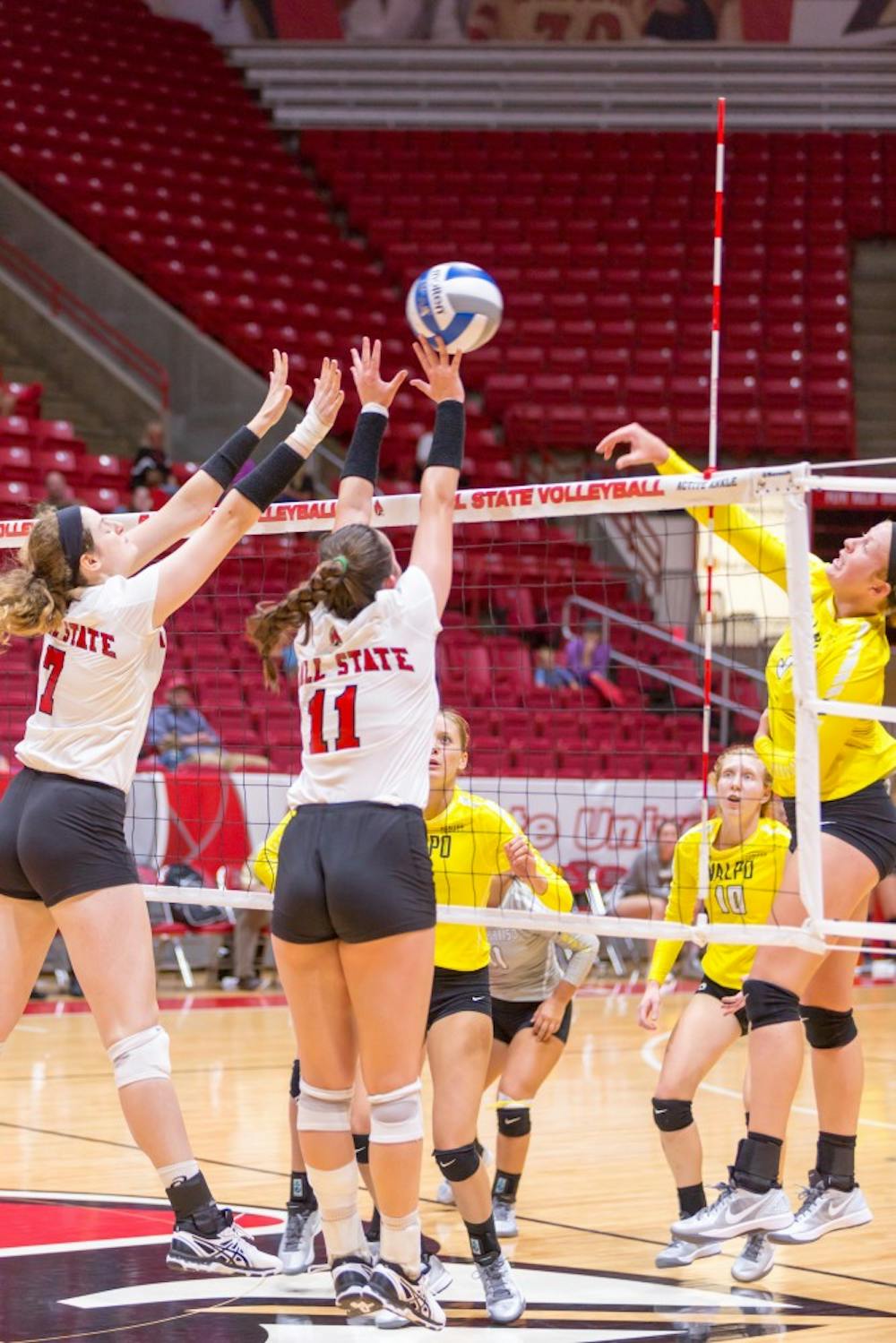 Sophomore middle hitter Emily Holland (left) and freshman setter Amber Seaman (right) jump up to block the ball at the game against Valparaiso on Sept. 16 at John E. Worthen Arena. Kyle Crawford // DN