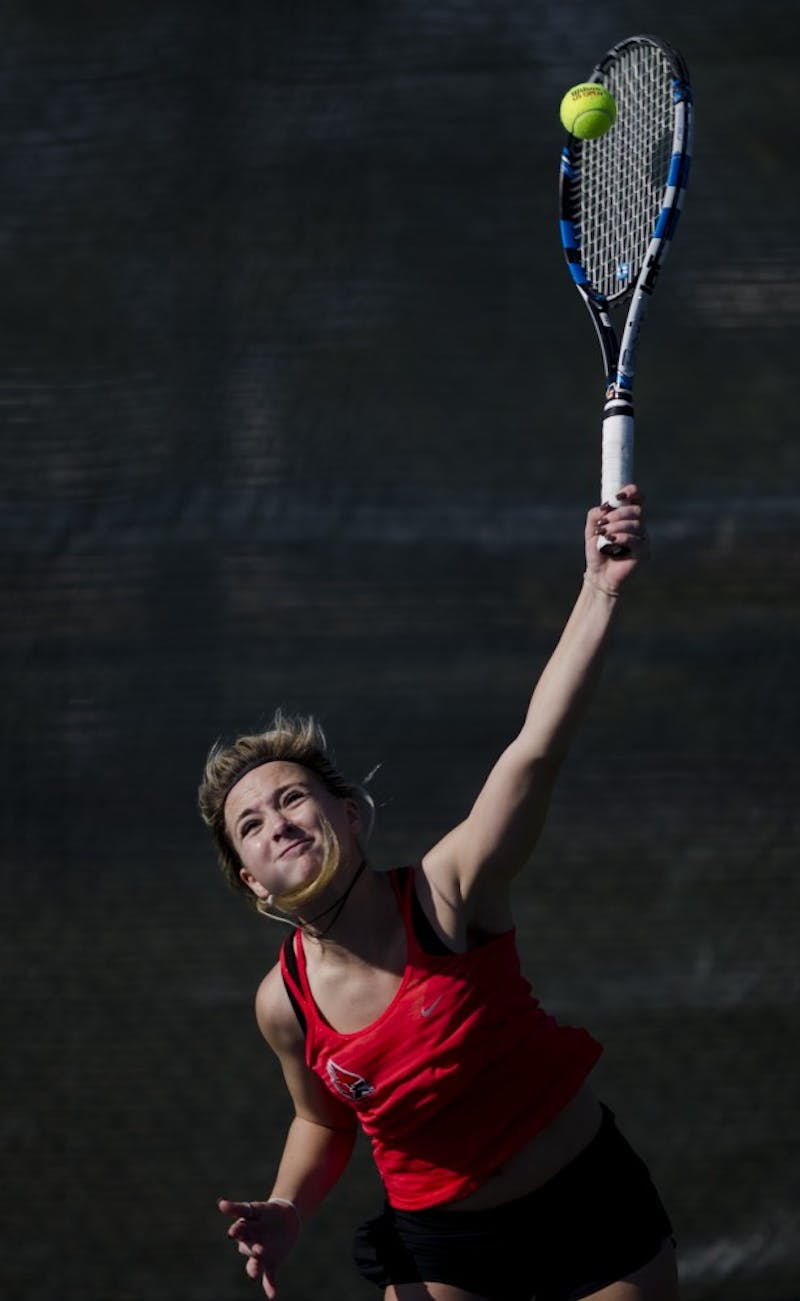 Sophomore Peyton Gollhofer serves during her singles match against IUPUI on Feb. 19. Emma Rogers // DN