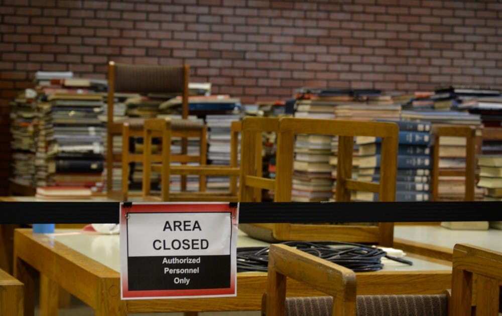 <p>Two months after a water leak in Bracken Library, renovations and repairs are still underway. Around 13,000 items have been tallied as damaged during the flooding. <em>DN PHOTO REBECCA KIZER</em></p>
