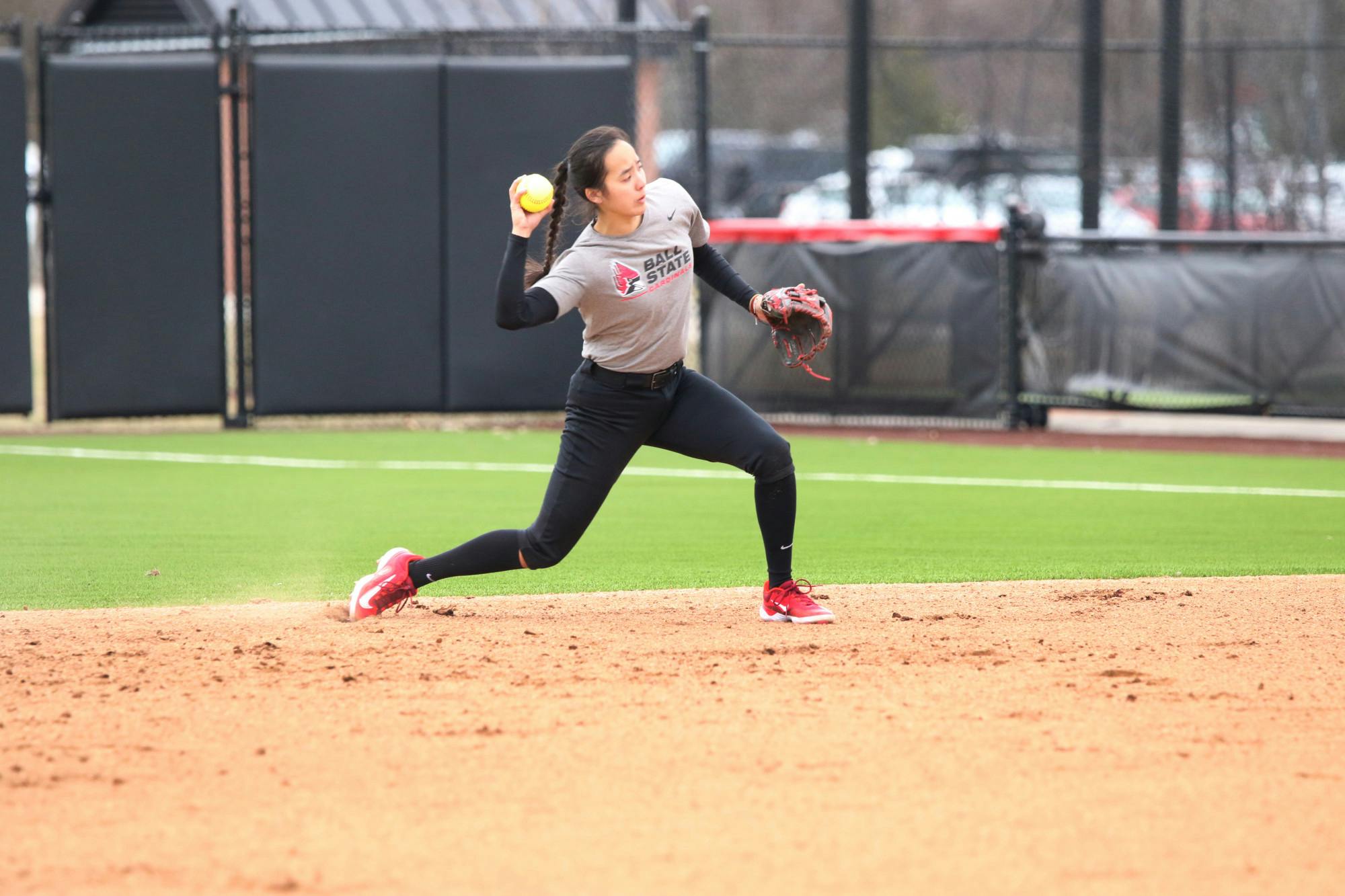 Redshirt Senior infielder Jazmyne Armendariz throws the ball to first base during a practice Feb. 14 at the Softball Filed at First Merchants Ballpark Complex. Zach Carter, DN
