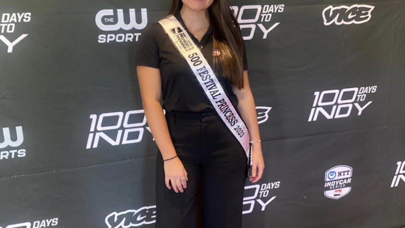 Savannah Boneta, third-year public relations major, poses with her crown and sash in Carmel, Indiana, for the premiere of 100 Days to Indy in early April.