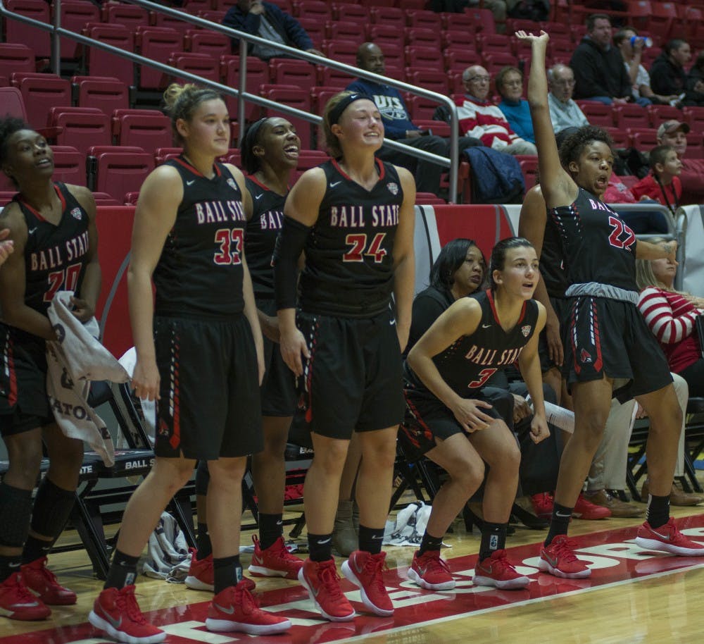 Members of the women's basketball team watch a shot go up during the game against University of Illinois Springfield on Nov. 1 at Worthen Arena. Breanna Daugherty, DN