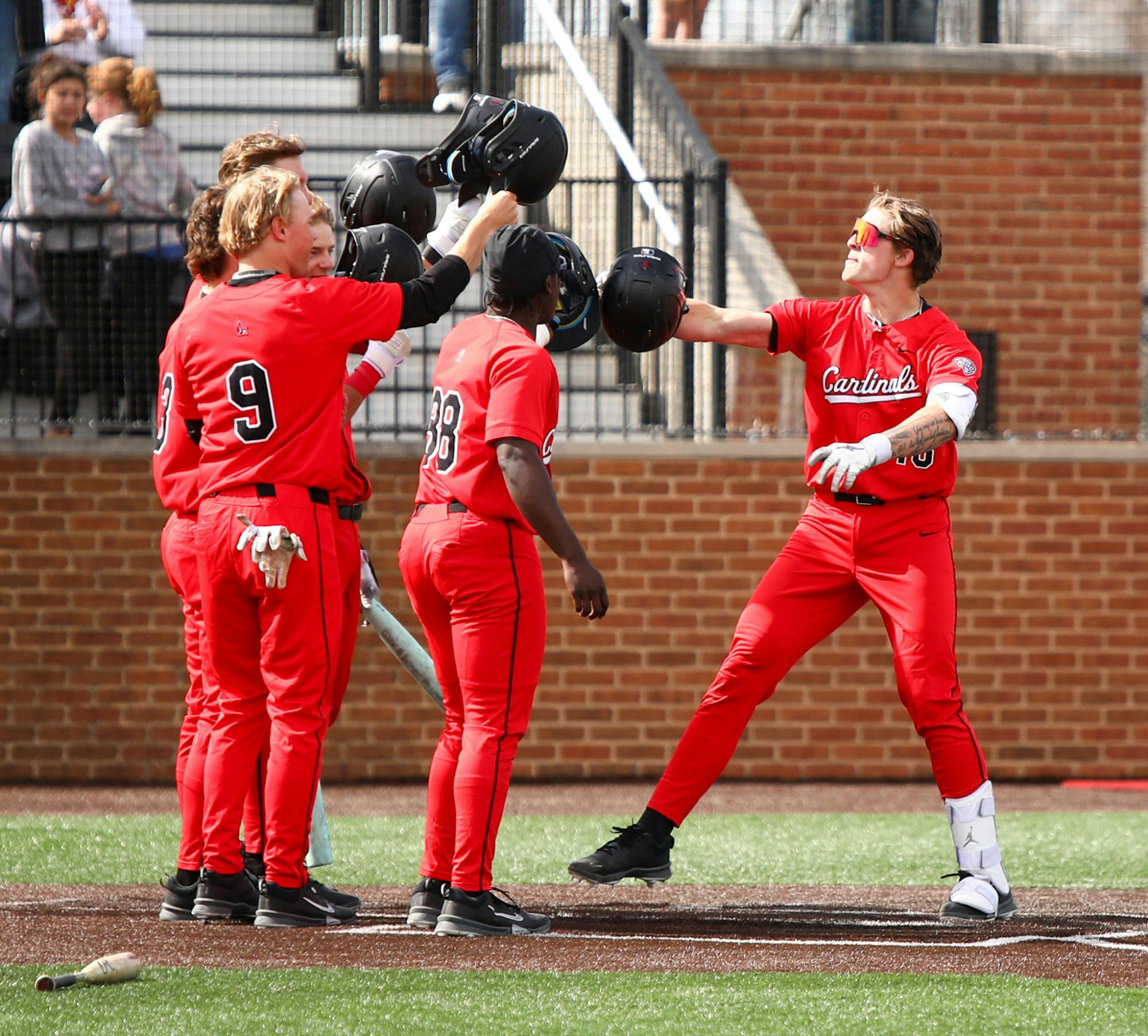 Ball State sophomore catcher DJ Scheumann celebrates with teammates after hitting a grand slam March 15 at Shebek Stadium. Scheumann has a .308 batting average this season. Adam Jones, DN
