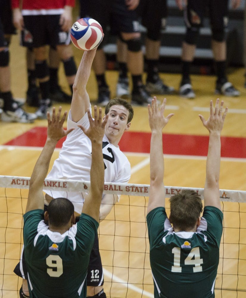 Junior outside attacker Matt Sutherland high-fives his teammates after getting a point in the match against Belmont Abbey on March 7 at Worthen Arena. Sutherland has had a total of 78 kills this season. DN FILE PHOTO BREANNA DAUGHERTY