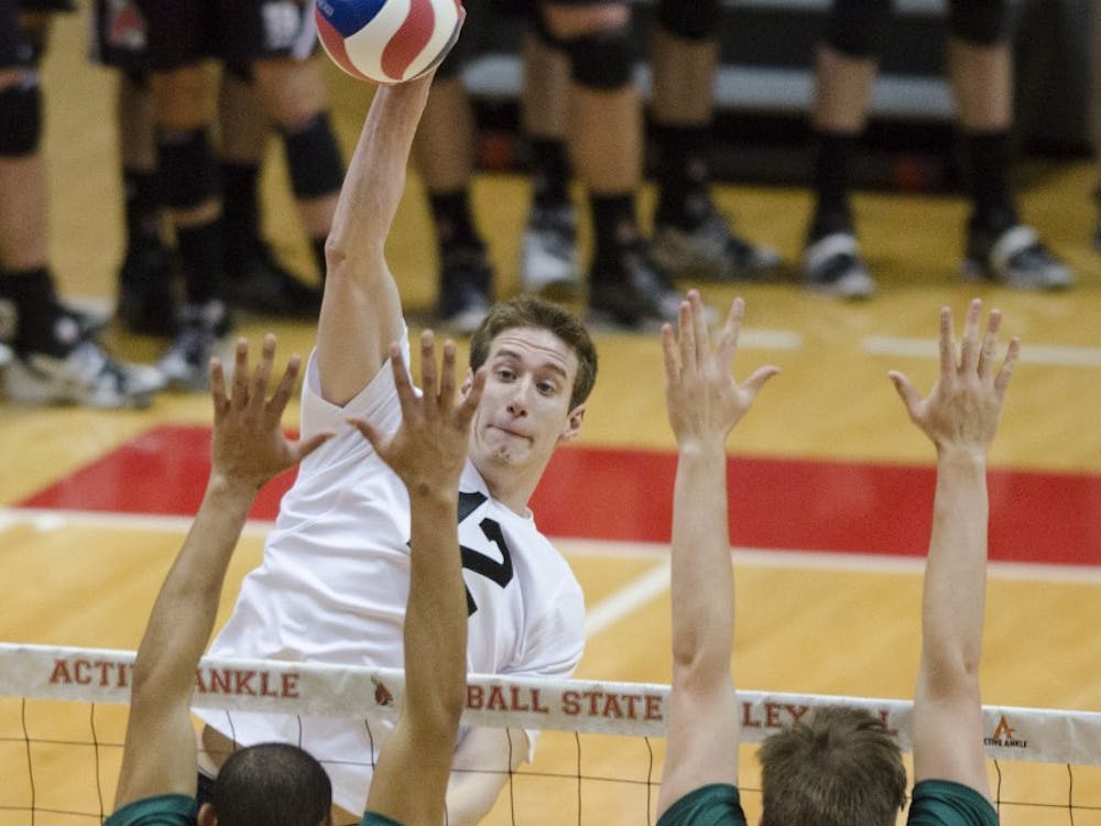 Junior outside attacker Matt Sutherland high-fives his teammates after getting a point in the match against Belmont Abbey on March 7 at Worthen Arena. Sutherland has had a total of 78 kills this season. DN FILE PHOTO BREANNA DAUGHERTY