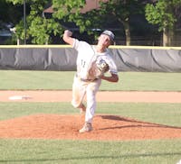 Delta sophomore Zane Cline prepares to throw a pitch May 29 during the Sectional #24 championship game at Yorktown High School. Zach Carter, DN. 