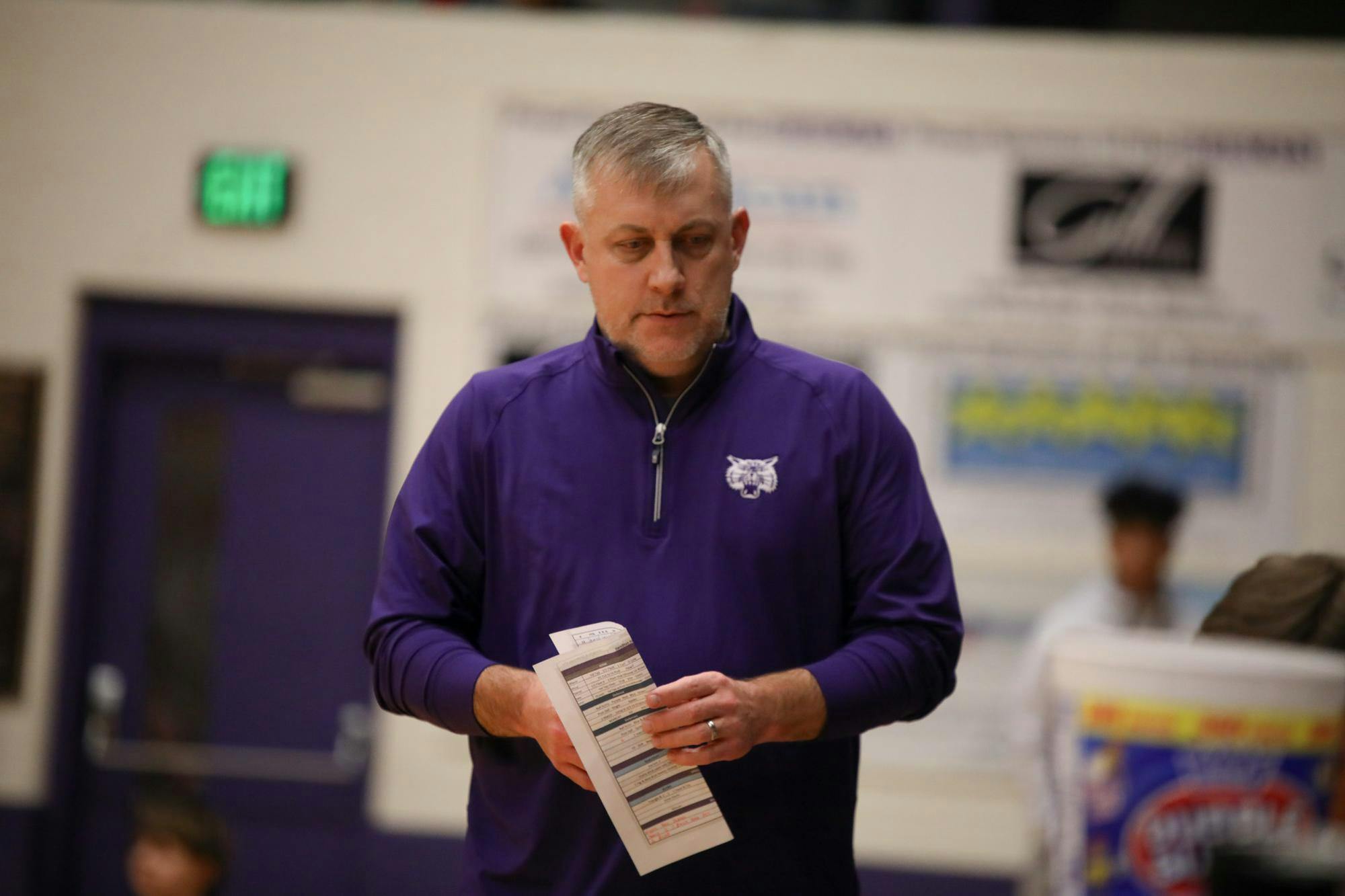 Muncie Central head coach Justin Ullom stands Dec. 14 during the Fieldhouse Classic at Muncie Central Fieldhouse. Zach Carter, DN.