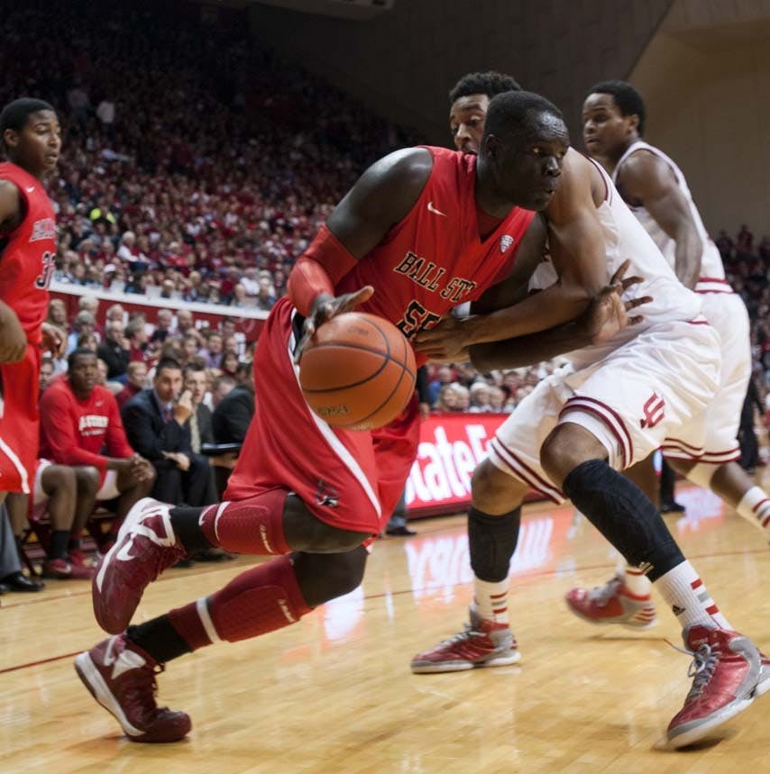 Junior forward Majok Majok attempts to push past an Indiana defender during the second half of the game on Sunday. Majok led the Cardinals with 18 points in the match. DN PHOTO BOBBY ELLIS