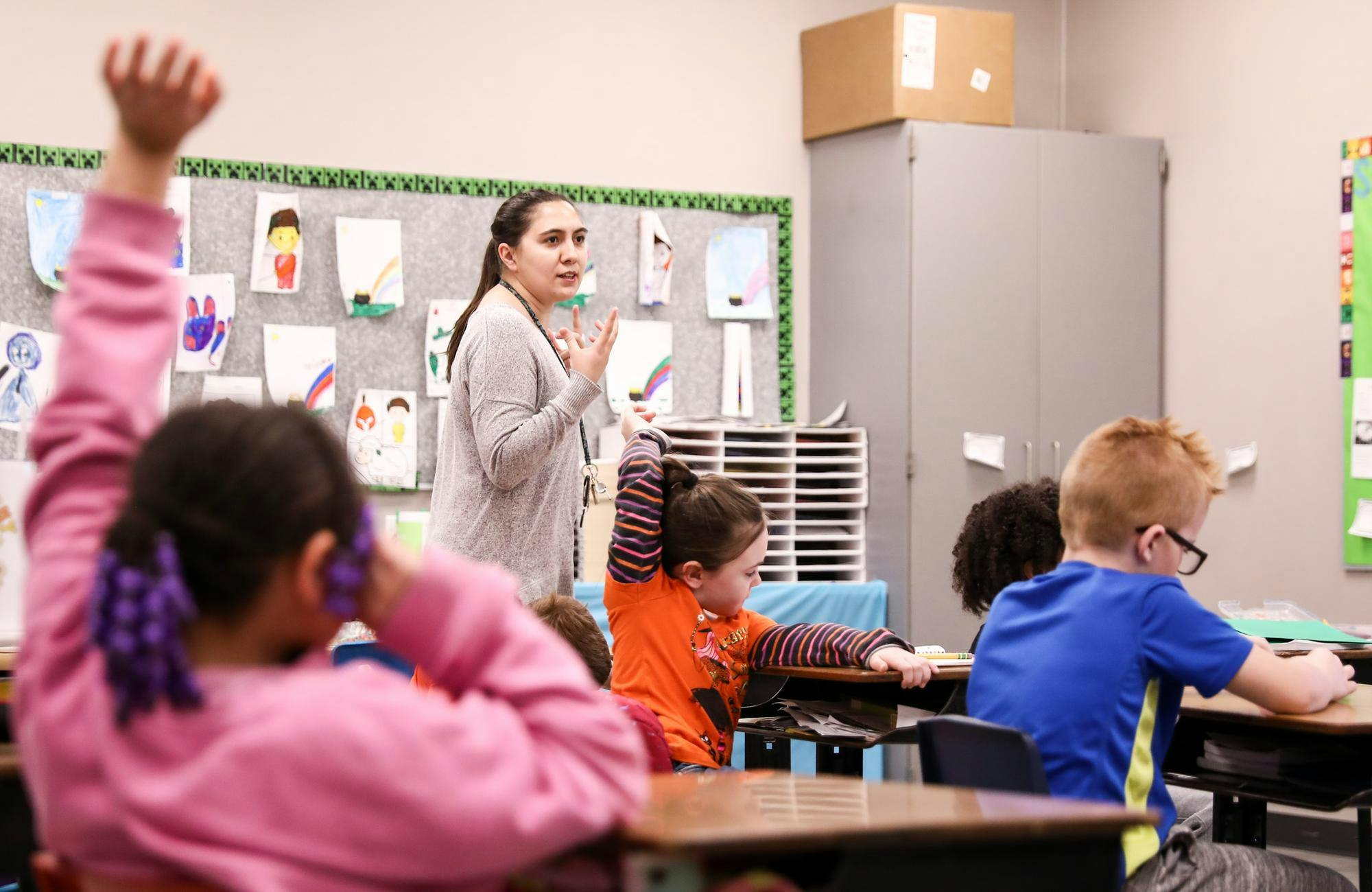 Second-grade teacher Savannah Oliphant teaches her students about beetles and other bugs April 8 at East Washington Academy. Once inside the classroom, students are met with curricula that satisfy the standards of “The Science of Reading.” Andrew Berger, DN 