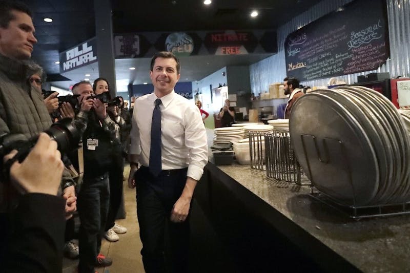 Democratic presidential candidate former South Bend, Ind., Mayor Pete Buttigieg arrives at Community Oven Pizza for a campaign event, Tuesday, Feb. 4, 2020, in Hampton, N.H. (AP Photo/Elise Amendola)