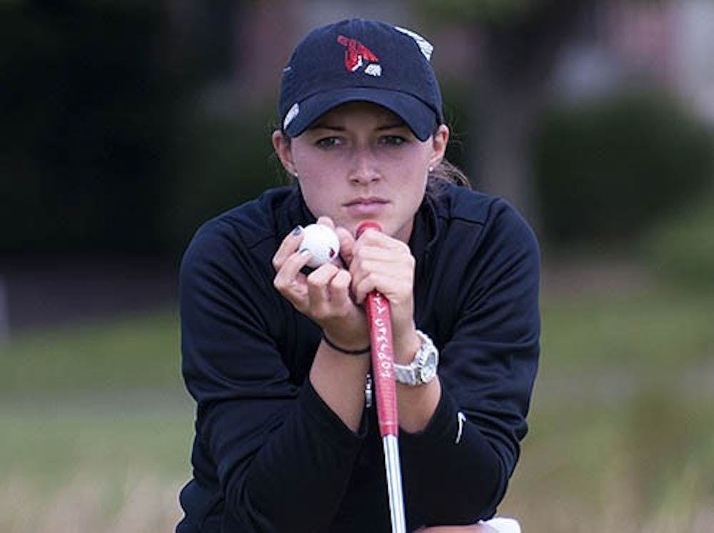 Junior Meghan Perry lines up a putt during the Cardinal Classic in September 2012. The women’s golf team will compete in their first meet since October 2012 on Sunday in the Jim West Challenge in Blanco, Texas. DN FILE PHOTO BOBBY ELLIS