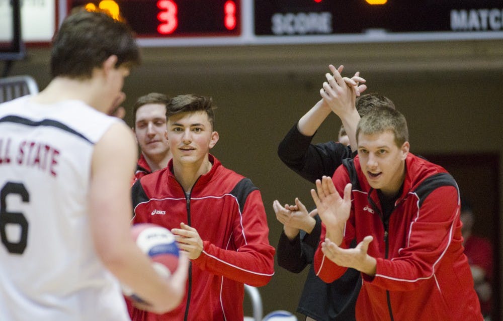 Members of the men's volleyball team cheer on the team on the sideline during the match against Harvard on Jan. 15 at Worthen Arena. DN PHOTO BREANNA DAUGHERTY