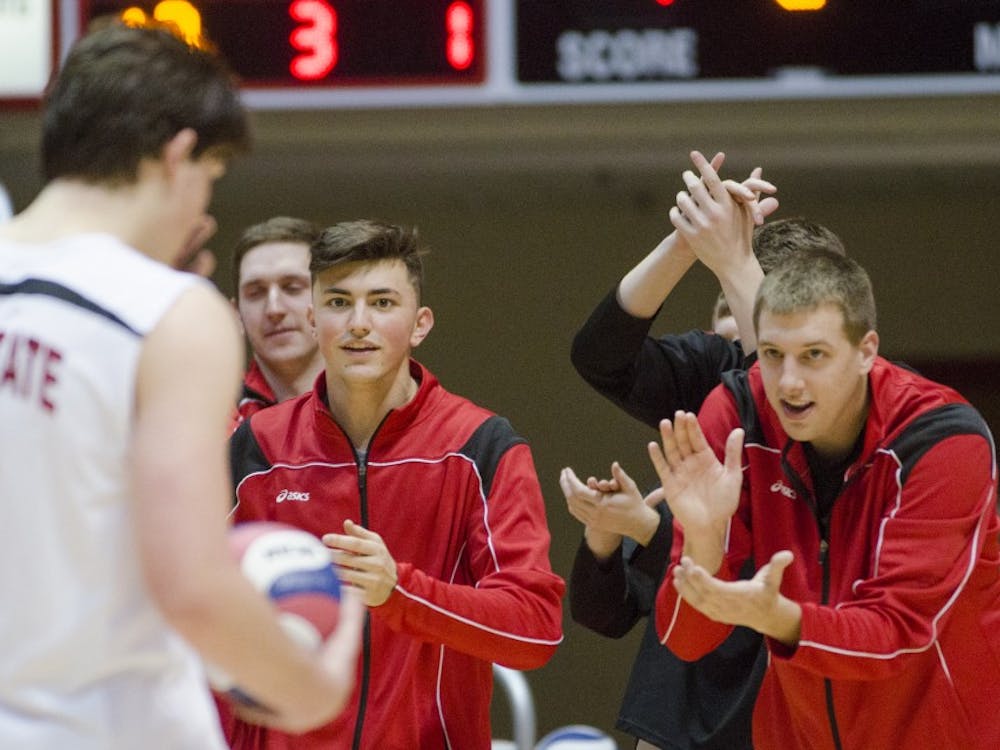 Members of the men's volleyball team cheer on the team on the sideline during the match against Harvard on Jan. 15 at Worthen Arena. DN PHOTO BREANNA DAUGHERTY