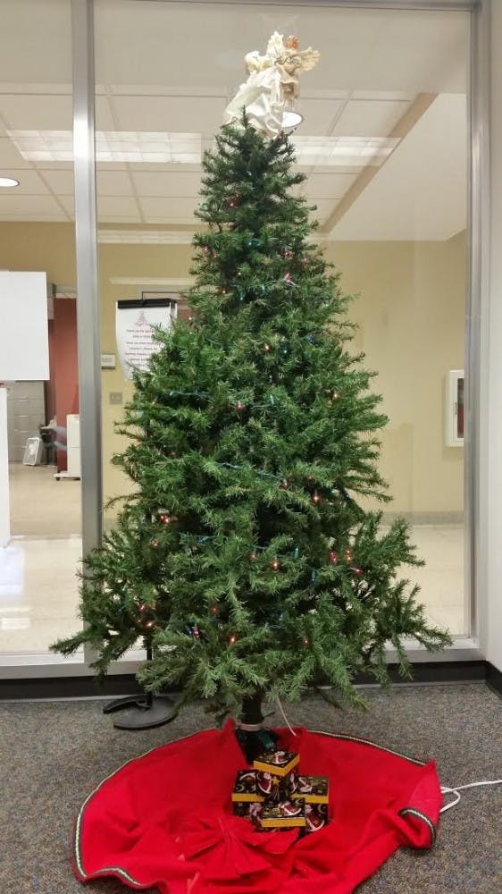 Student Voluntary Services put up an Angel Tree for the 23rd time this year. Students "adopted" an angel with a child's name on it from the tree and bought gifts the children. DN PHOTO STEPHANIE AMADOR
