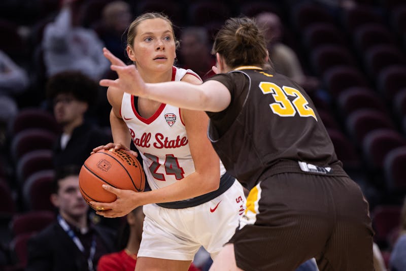 Ball State senior Madelyn Bischoff looks for a pass against Western Michigan during the first round of the Mac Championship on March 12, at Rocket Arena in Cleveland Oh. Ball State won 82-53. Titus Slaughter, DN.