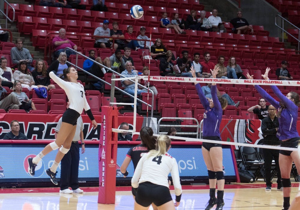 Junior outside hitter Brooklyn Goodsel spikes the ball at the game against Evansville on Sept.14 at John E. Worthen Arena. The Cardinals had 44 kills. Emily Coats, DN
