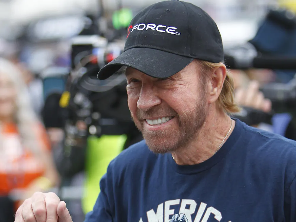 Celebrity announcer Chuck Norris leaves the stage during driver introductions at the AAA Texas 500 on Sunday, Nov. 6, 2016 at Texas Motor Speedway in Fort Worth, Texas. (David Kent/Fort Worth Star-Telegram/TNS)