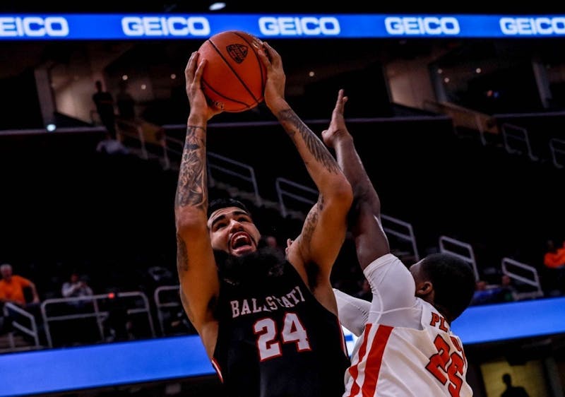 Senior center Trey Moses takes a shot at Quicken Loans Arena in Cleveland, March 14, 2019. Rebecca Slezak, DN