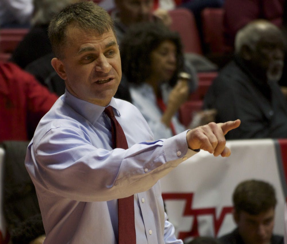 James Whitford, the head of the Ball State men’s basketball team, coaches from the sidelines in the game against Eastern Michigan in Worthen Arena on Feb. 27. The Cardinals beat their record of highest number of points since 1989, scoring 115 to 79. DN PHOTO GRACE RAMEY
