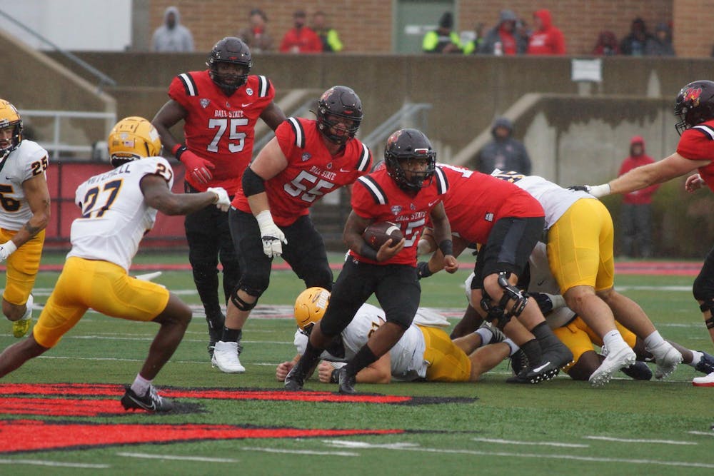 Redshirt junior running back Marquez Cooper rushes between tackles against Toledo Oct. 14 at Scheumann Stadium. Cooper had 60 rushing yards in the 13-6 loss to the Rockets. Daniel Kehn, DN